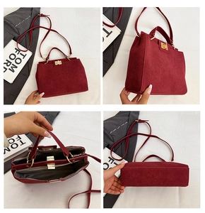 Detailed views of dark red matte handbag with gold buckle and multi-layer interior compartments