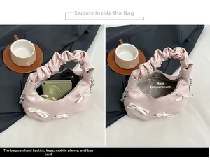Internal view of pink bow handbag showing space for phone, wallet and cosmetics