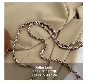 Detail of adjustable pink leather strap woven with silver chain for women handbag