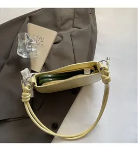 Detail view of cream hobo bag interior showing ample space for two smartphones