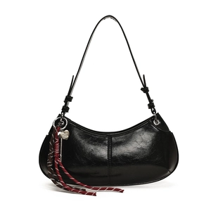 Glossy black half-moon underarm bag with silver heart charm and braided rope detail