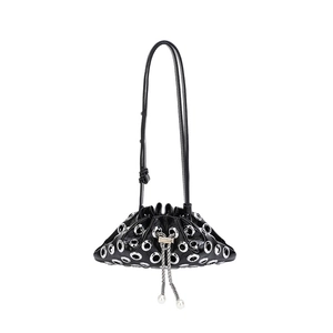 Fashionable black patent leather rivet bucket bag with silver eyelets and pearl drawstring