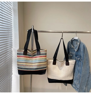 Detail of woven tote bags showing high-capacity texture and black reinforced base