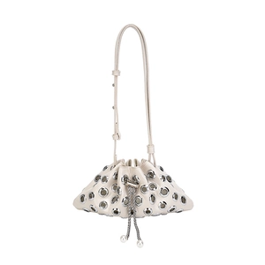 Creamy white drawstring bucket bag with silver metal eyelets and pearl detail