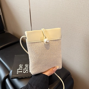 Mini straw woven crossbody bag in beige with pearl buckle and slim shoulder strap