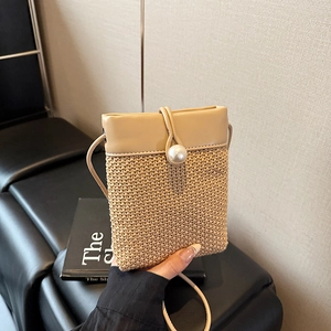 Mini straw woven shoulder bag with pearl clasp and khaki leather trim for summer wear