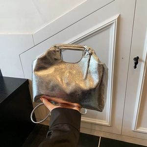 Silver metallic tote bag with textured stone finish and integrated handle for women
