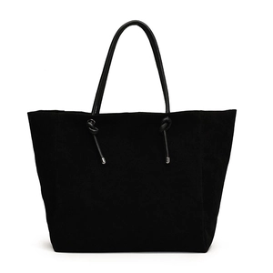 Minimalist black matte suede tote bag with glossy leather knotted handles for women