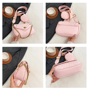 Detail view of pink V-quilted small square bag with wide strap and round coin purse