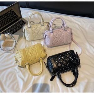 Top view of sparkling quilted Boston bags with rhinestones in four elegant colors