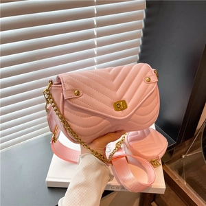 Pink quilted crossbody bag with golden twist lock and stylish wide shoulder strap