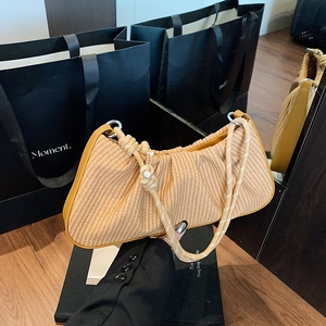 Chic woven cloud baguette bag with gathered pleats and knotted rope shoulder strap