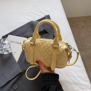 Quilted yellow Boston bag with crystal rhinestones and silver-tone hardware accents