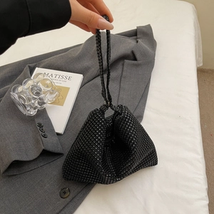 Minimalist black rhinestone mesh handbag in a stylish triangular shape with hand strap