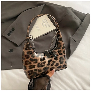 Glossy leopard print underarm bag with silver chain strap and hobo moon shape design