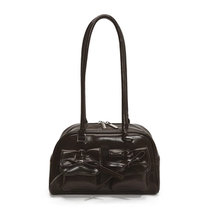 Deep coffee brown shoulder bag with bow details and twin front pockets on white background