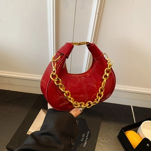 Chic red patent leather dumpling bag with gold chain strap and H-shaped buckle detail