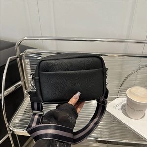 Litchi pattern leather crossbody camera bag with wide striped strap and silver hardware