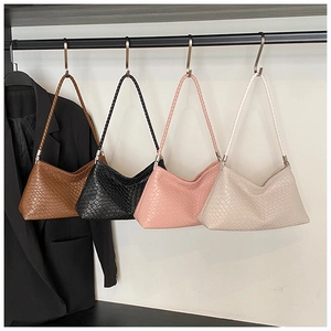Detailed row of woven texture underarm bags in brown, black, pink, and off-white colors