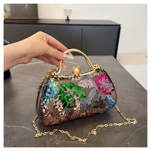 Detail of colorful sequins and pearl clasp on the vintage evening clutch bag