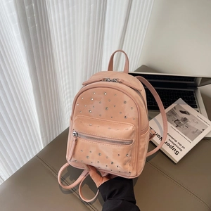 Pink mini rhinestone backpack with diamond quilted pattern and silver metallic zippers