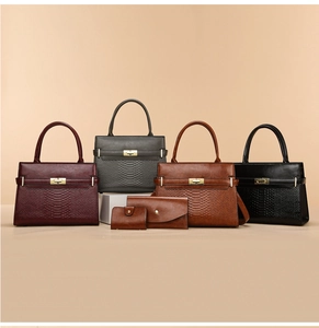 Detail view of the four-piece fashion handbag set with textured snakeskin pattern