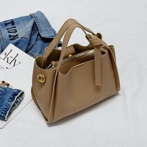 Minimalist khaki lychee pattern leather tote bag with knotted strap and gold hardware