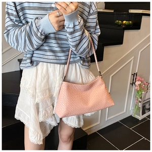 Pink woven faux leather shoulder bag with intricate Intrecciato texture for women