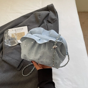 Light blue ruched cloud bag with silver rhinestones and metal chain shoulder strap