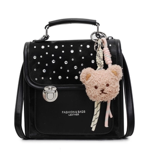 Fashionable black leather backpack with rhinestones and pink teddy bear keychain