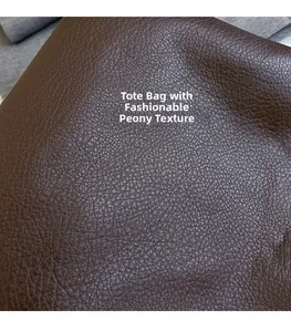 Close-up of deep brown lychee grain texture on high-quality tote bag synthetic leather
