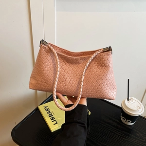 Pink woven leather shoulder bag with Intrecciato pattern and silver hardware