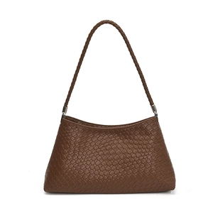 Vintage brown woven texture shoulder bag with elegant silver hardware in a minimalist style