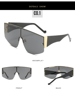 Three-angle views showing gray oversized shield sunglasses with gold hinge accents