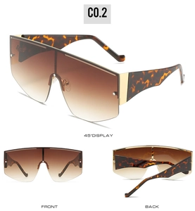 Detailed views of tortoise oversized shield sunglasses with brown gradient lenses