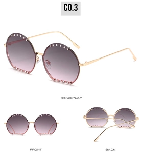 Détails des lunettes de soleil rondes demi-cerclées avec verres dégradés et strass argentés