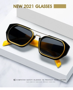 Detail of trendy double bridge sunglasses with black frames and yellow interior accents