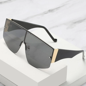 Fashionable oversized shield sunglasses with black lenses and gold metal details