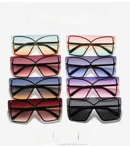 Oversized one-piece sunglasses in multiple gradient lens colors with hollow cross bridge