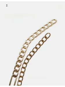 Macro detail of the curved golden chain temple design on stylish oversized sunglasses