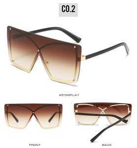 Detailed views of oversized shield sunglasses with gradient brown lenses and rivets