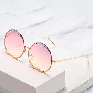 Lunettes de soleil rondes sans monture avec dégradé de couleurs et cristaux étincelants