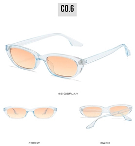 Détail de lunettes de soleil ovales rétro avec monture bleue et verres orange transparent