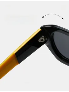 Detail of durable metal hinges on dual-tone sunglasses showing high-quality texture