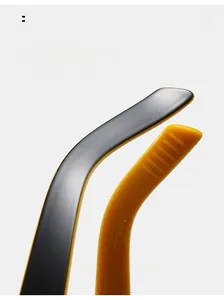 Detail of curved sunglasses legs with dual-tone black and yellow ergonomic design