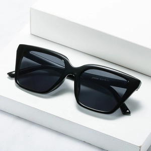 Fashionable square frame sunglasses with black glossy finish and dark grey protective lenses
