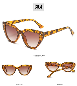 Detailed view of cat-eye sunglasses with tortoise frame and gradient brown lenses