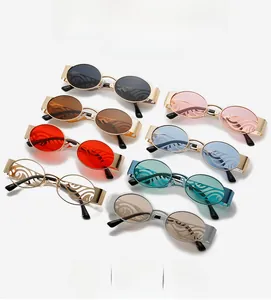 Detail showing various colored oval lenses with unique wavy patterns and gold metal temples