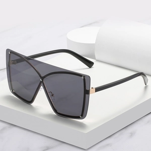 Oversized wrap-around sunglasses with black frames and silver rivet accents