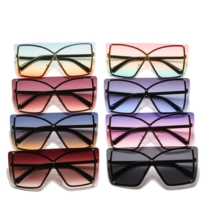 Oversized trendy shield sunglasses with gradient lenses and decorative metal rivets
